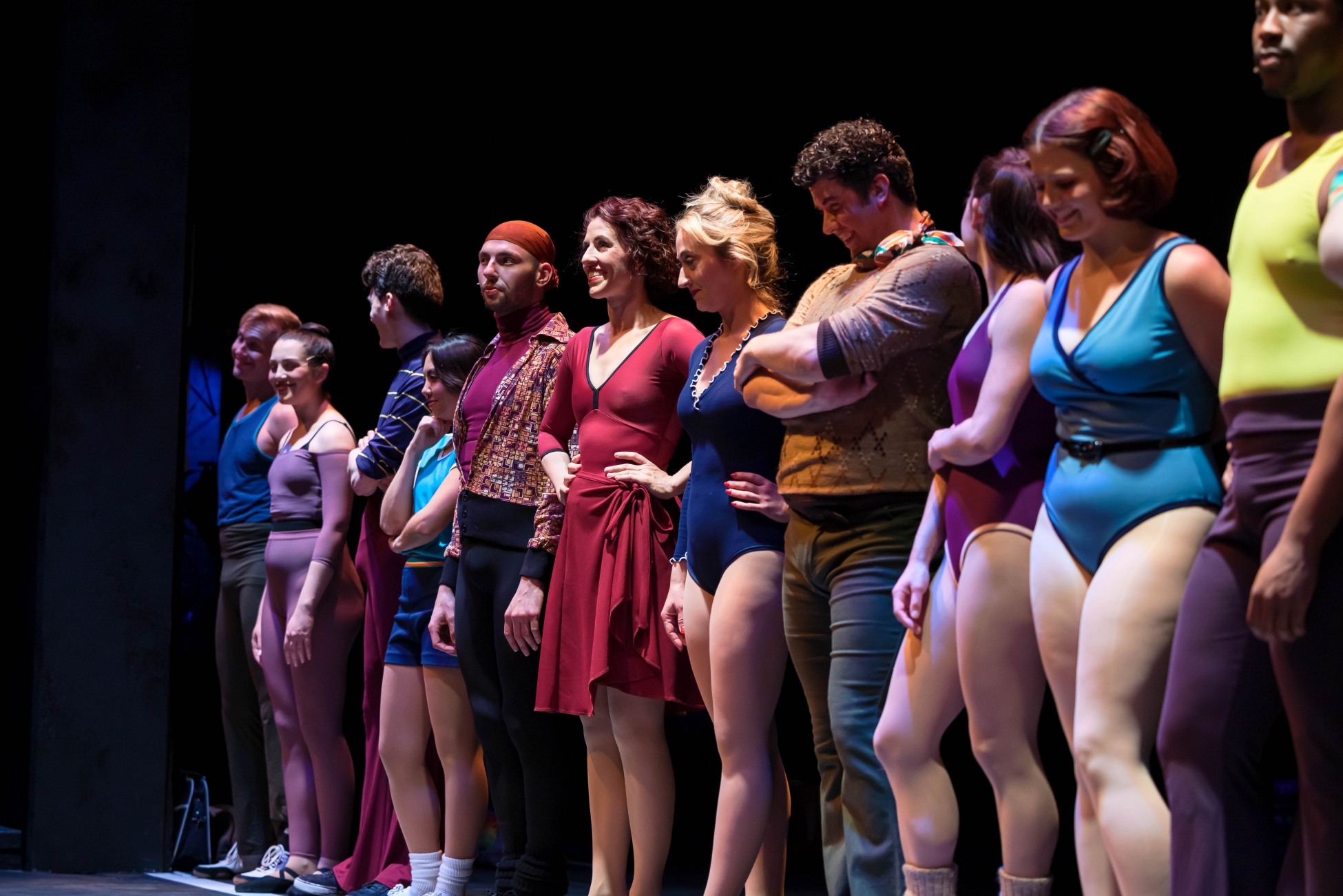 Auditioners in A Chorus Line stand in a line.