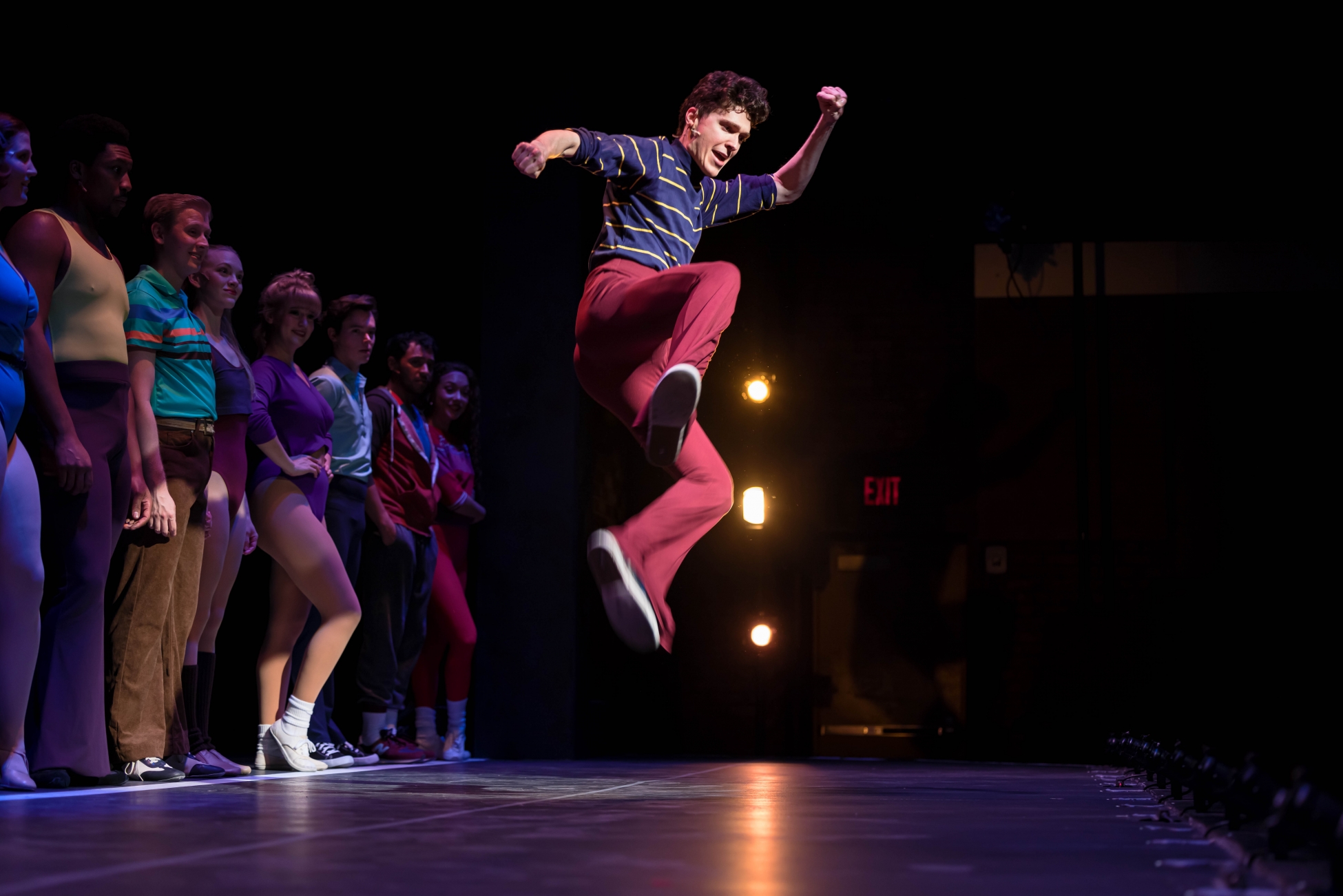 Ryan Ardelt as Mike in A Chorus Line leaps in the air.