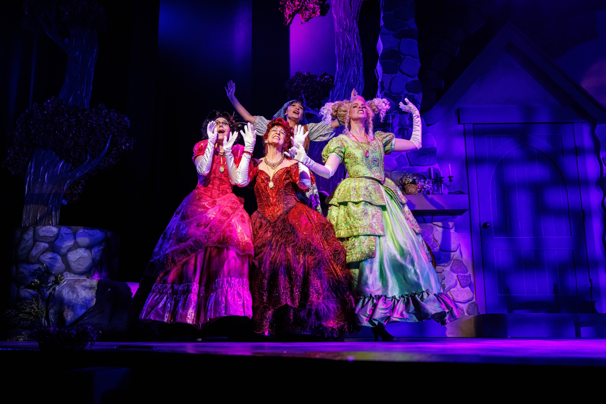Cinderella, her stepmother, and her stepsisters dance, lost in thoughts of love.