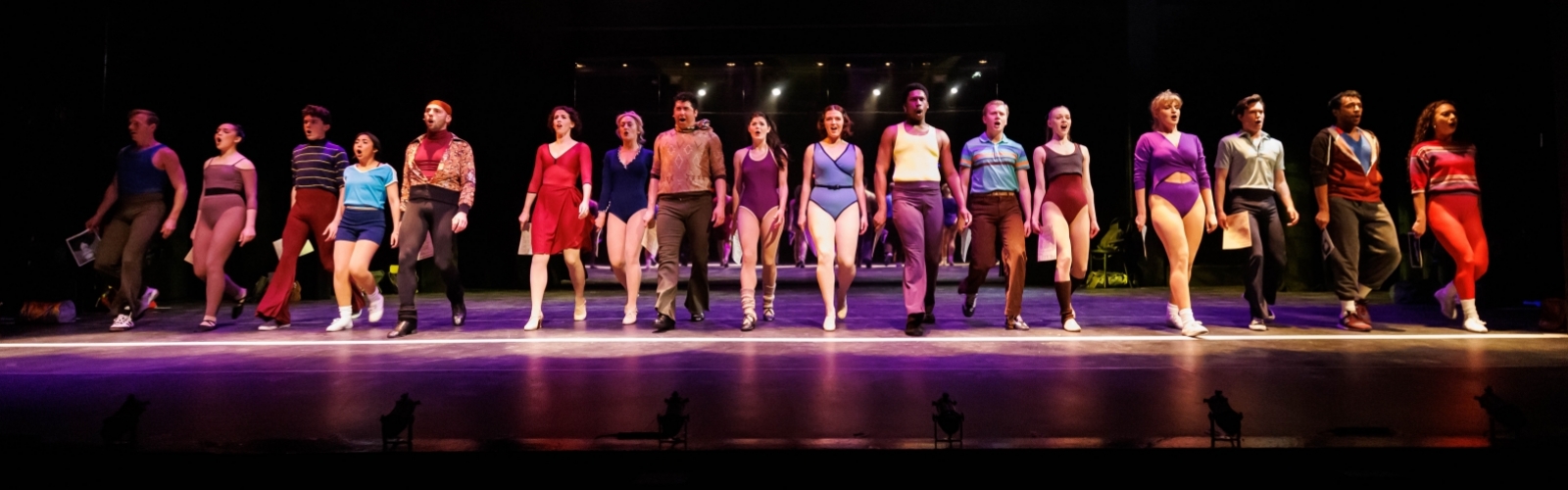 The cast of A Chorus Line stand in line.