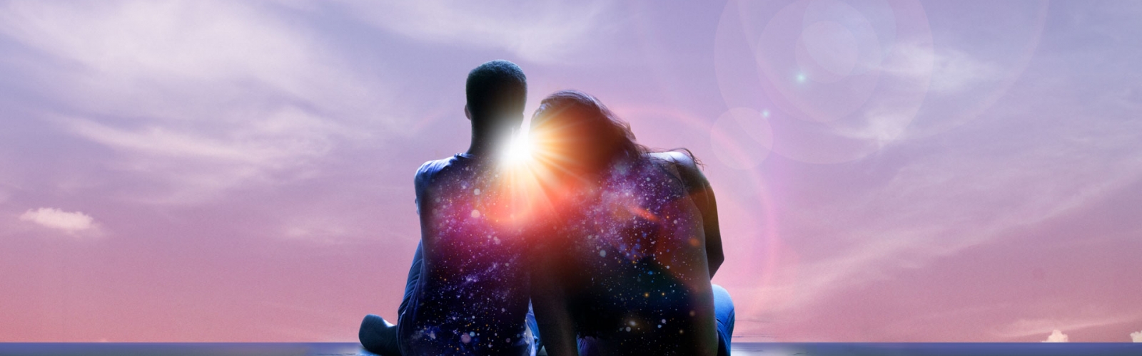 A seated couple leans together, a constellation on their backs, the sun shining through between them