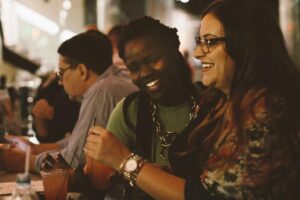 A group of people enjoying drinks at the ArtBar Bistro.