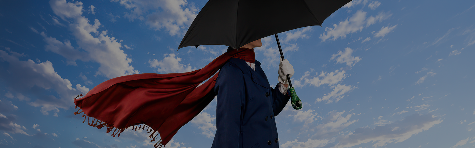Promotional artwork for “Cameron Mackintosh and Disney’s Mary Poppins” at The Phoenix Theatre Company, running November 18, 2026–January 3, 2027. A woman stands above an in front of a cloudy blue sky, wearing a peacoat and flowing red scarf. She holds a parrot-head-handled umbrella that obscures her face.